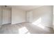 Bright bedroom with neutral carpet features two closets and a window that let in natural light at 4495 Riders Ridge Trl, Snellville, GA 30039