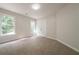Inviting bedroom filled with natural light from two windows and a double door closet for storage at 4495 Riders Ridge Trl, Snellville, GA 30039