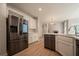 Spacious kitchen with stainless steel appliances, white cabinets, and an eat-in island at 4495 Riders Ridge Trl, Snellville, GA 30039