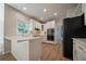 Modern kitchen with white cabinets, quartz countertops, stainless steel appliances at 4495 Riders Ridge Trl, Snellville, GA 30039