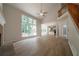 Bright living room with fireplace, high ceilings, hardwood floors, and large windows at 4495 Riders Ridge Trl, Snellville, GA 30039