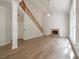 Spacious living room featuring a brick fireplace, vaulted ceiling, and large windows at 4495 Riders Ridge Trl, Snellville, GA 30039