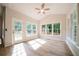 Cozy sunroom filled with natural light from many windows and a glass door at 4495 Riders Ridge Trl, Snellville, GA 30039