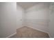 Empty walk-in closet with door and shelving installed, ready for storage needs at 4495 Riders Ridge Trl, Snellville, GA 30039
