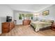 Bright bedroom featuring a comfortable bed, dresser, and ample natural light at 472 Sherman Way, Decatur, GA 30033