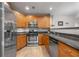 Well-equipped kitchen with stainless steel appliances and granite countertops at 472 Sherman Way, Decatur, GA 30033