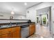 Kitchen with wood cabinetry, stainless steel appliances and granite countertops at 472 Sherman Way, Decatur, GA 30033