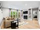 Bright living room with wood floors, a fireplace, and access to a balcony at 472 Sherman Way, Decatur, GA 30033