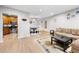 Open-concept living area with a dining table and chairs, flowing seamlessly into the kitchen at 472 Sherman Way, Decatur, GA 30033