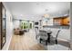 Open-concept living room with hardwood floors and plenty of natural light at 472 Sherman Way, Decatur, GA 30033