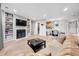 Inviting living room with a fireplace, built-in shelves, and a view to the dining area at 472 Sherman Way, Decatur, GA 30033