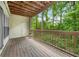 Covered porch overlooking a tranquil wooded area, perfect for outdoor relaxation at 472 Sherman Way, Decatur, GA 30033