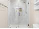 Beautifully tiled shower with a frameless glass door and built-in niche offering both style and practicality at 472 Sherman Way, Decatur, GA 30033