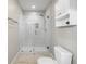 Updated shower with a sleek, frameless glass enclosure and white marble tile adding a modern and clean feel to the bathroom at 472 Sherman Way, Decatur, GA 30033