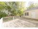 A wooden back deck connects to an additional structure near the landscaped backyard at 70 Mount Paran Ne Rd, Atlanta, GA 30342