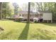 A well-maintained backyard with flowering plants in the landscaped yard at 70 Mount Paran Ne Rd, Atlanta, GA 30342