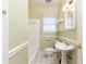 Cozy bathroom with a shower-tub combo, pedestal sink, and classic white tile at 70 Mount Paran Ne Rd, Atlanta, GA 30342