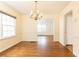 Dining room with hardwood floors, elegant chandelier, and abundant natural light at 70 Mount Paran Ne Rd, Atlanta, GA 30342