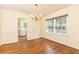 Dining room features hardwood floors, a chandelier, and bright window views at 70 Mount Paran Ne Rd, Atlanta, GA 30342
