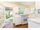 Kitchen features white cabinets, neutral countertops, and access to an outdoor deck at 70 Mount Paran Ne Rd, Atlanta, GA 30342