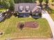Aerial shot of the house with a well-manicured lawn and a long driveway at 90 Alcovy Reserve Way, Covington, GA 30014