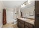 Bathroom featuring a single vanity and a shower and tub combo at 90 Alcovy Reserve Way, Covington, GA 30014