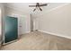 Bright bedroom featuring neutral walls, carpet and a ceiling fan at 90 Alcovy Reserve Way, Covington, GA 30014