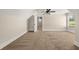 Spacious bedroom featuring neutral walls, plush carpet, and a ceiling fan for added comfort at 90 Alcovy Reserve Way, Covington, GA 30014