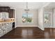 Bright dining area featuring wood floors, wainscoting, and stone accents at 90 Alcovy Reserve Way, Covington, GA 30014