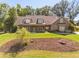 Charming home featuring a manicured front yard, dormers, and siding at 90 Alcovy Reserve Way, Covington, GA 30014