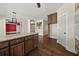 Spacious kitchen showcasing wood floors, island, and an open-concept design at 90 Alcovy Reserve Way, Covington, GA 30014