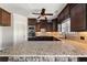 Gourmet kitchen featuring granite countertops, dark cabinets, and stainless appliances at 90 Alcovy Reserve Way, Covington, GA 30014