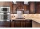 Kitchen area featuring stainless steel appliances, granite counters, and ample storage at 90 Alcovy Reserve Way, Covington, GA 30014