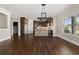 Elegant eat-in kitchen boasting stone accents, dark cabinetry, and stainless appliances at 90 Alcovy Reserve Way, Covington, GA 30014