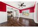 Living room view leading to kitchen, showcasing hardwood floors and natural light at 90 Alcovy Reserve Way, Covington, GA 30014