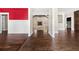 Spacious living room showcasing hardwood floors, wainscoting, and bright light at 90 Alcovy Reserve Way, Covington, GA 30014