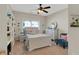Bright bedroom featuring neutral tones, soft carpet, and a bookshelf at 125 Rabbits Run, Fayetteville, GA 30215