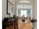 Elegant dining room with hardwood floors, chandelier, and natural light at 125 Rabbits Run, Fayetteville, GA 30215