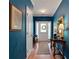 Entryway with deep blue walls, hardwood floors, and decorative accents at 125 Rabbits Run, Fayetteville, GA 30215
