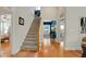 Inviting foyer with hardwood floors, staircase, and views into other rooms in this well-maintained home at 125 Rabbits Run, Fayetteville, GA 30215