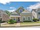Charming two-story home with a well-manicured lawn, lush landscaping and inviting front porch at 125 Rabbits Run, Fayetteville, GA 30215