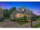 A beautiful two-story home with inviting front porch and well-maintained landscaping at 125 Rabbits Run, Fayetteville, GA 30215