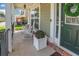 Inviting covered porch with rocking chairs, brick accents, and a beautifully decorated front door at 125 Rabbits Run, Fayetteville, GA 30215