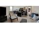 Spacious living room with home office area, featuring neutral décor and furniture at 125 Rabbits Run, Fayetteville, GA 30215
