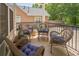 Relaxing covered porch with wicker furniture and comfortable cushions at 125 Rabbits Run, Fayetteville, GA 30215