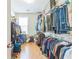 Walk-in closet with hardwood floors, shelving, and plenty of storage space at 125 Rabbits Run, Fayetteville, GA 30215