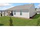 Manicured backyard featuring lawn, patio with outdoor seating, and rear home elevation at 41 Balsam Dr, Dallas, GA 30157