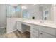 Bright bathroom featuring double sinks, vanity with drawer storage, and glass door shower at 41 Balsam Dr, Dallas, GA 30157