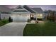 Charming home with a well-manicured lawn, two-car garage, and inviting front entrance at dusk at 41 Balsam Dr, Dallas, GA 30157