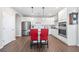 Spacious kitchen with stainless steel appliances, including double ovens and modern island with red barstools at 41 Balsam Dr, Dallas, GA 30157